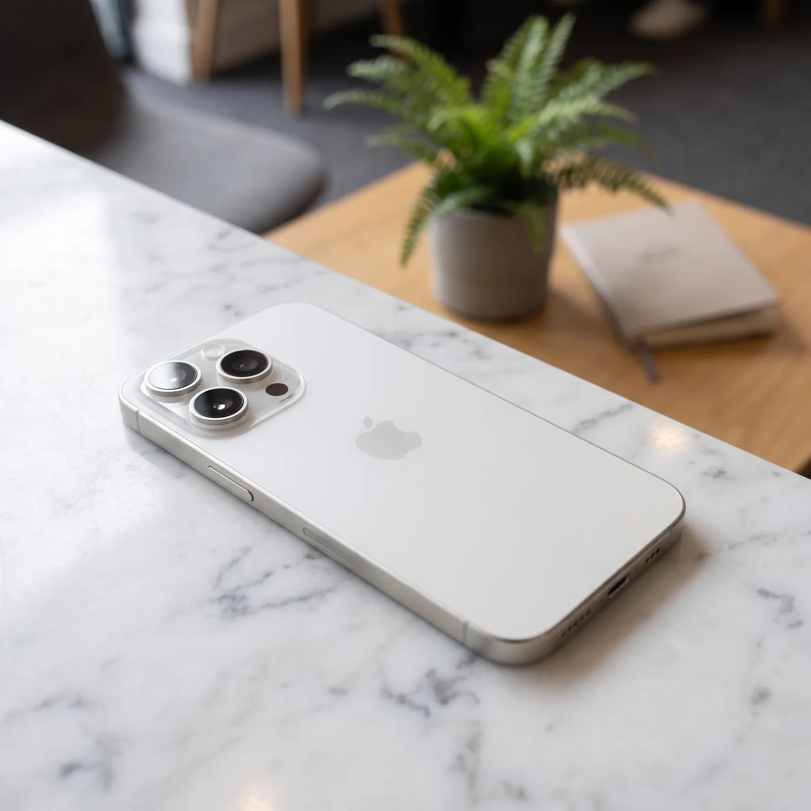 Refurbished Apple iPhone 15 Pro White in use showing display and camera, MTM IT certified