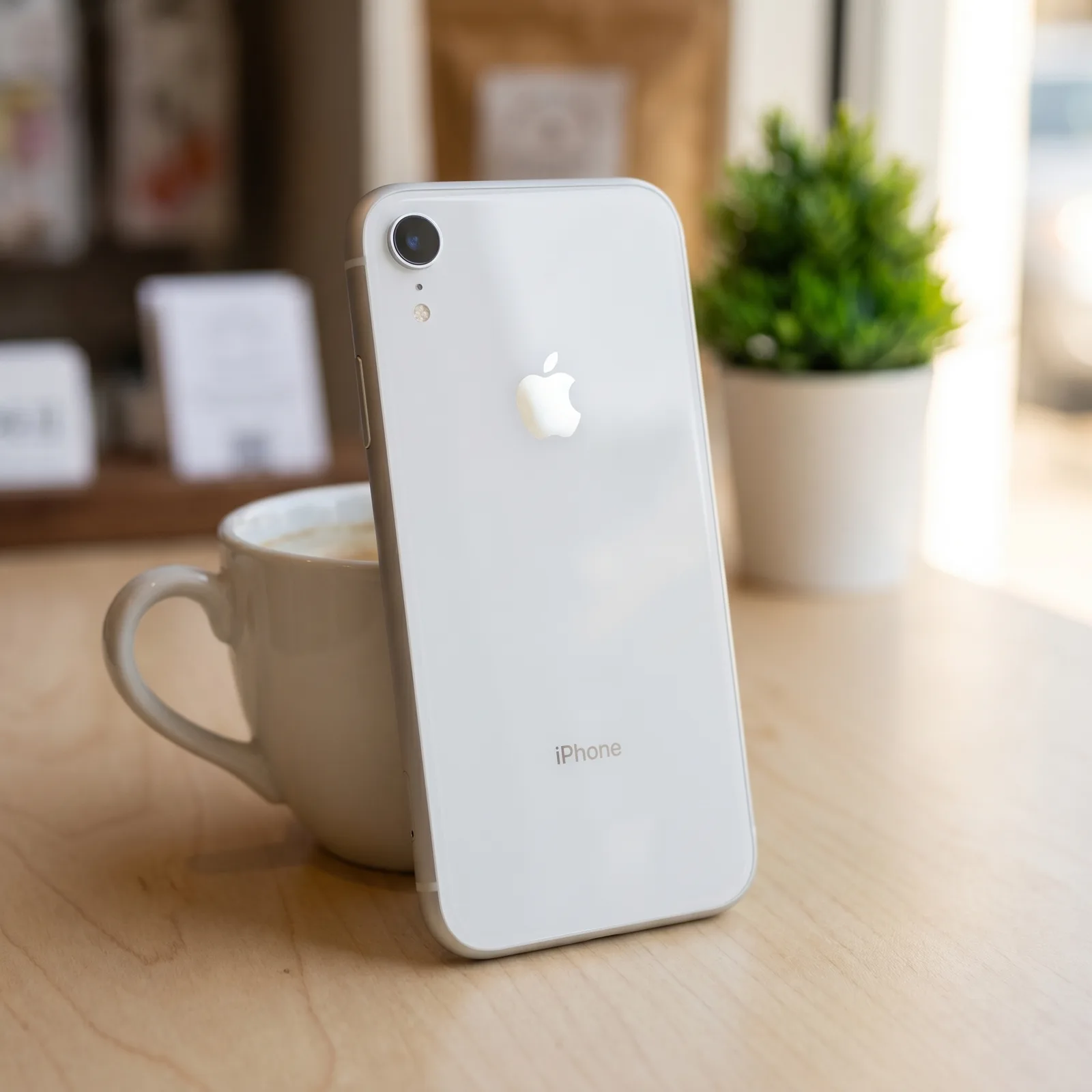 Apple iPhone XR 64GB White in hand – showing Liquid Retina display – refurbished by MTM IT